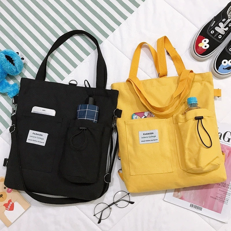Harajuku style bags in black and yellow, featuring multiple pockets for students, stylish canvas material.
